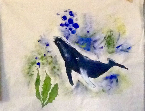 a canvas of a whale painted on cotton fabric